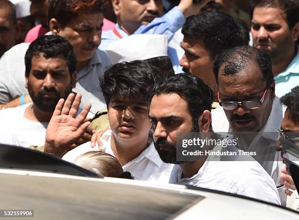 The grieving relatives of Sant Nirankari Mission Head Baba Hardev Singh Ji Maharaj join his funeral procession as it proceeded towards the Nigam Bodh...