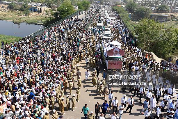 Thousands of devotees join the funeral procession of Sant Nirankari Mission Head Baba Hardev Singh Ji Maharaj and his son-in-law Avneet Setya at...