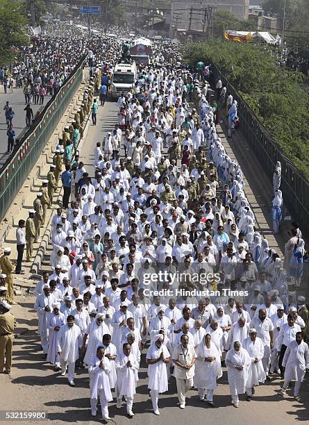 Thousands of devotees join the funeral procession of Sant Nirankari Mission Head Baba Hardev Singh Ji Maharaj and his son-in-law Avneet Setya at...