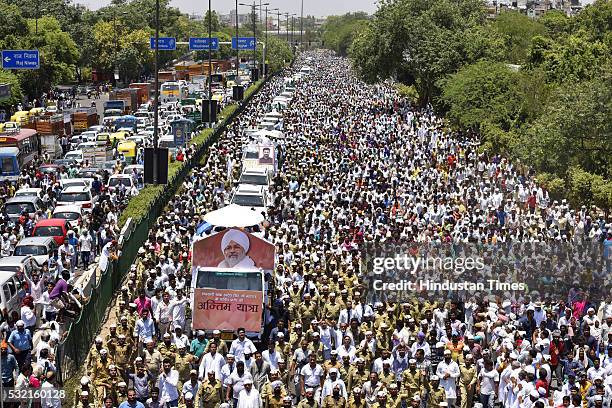 Thousands of devotees join the funeral procession of Sant Nirankari Mission Head Baba Hardev Singh Ji Maharaj and his son-in-law Avneet Setya at...