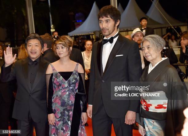 Japanese director Kore-Eda Hirokazu, Japanese actress Maki Yoko, Japanese actor Abe Hiroshi and Japanese actress Kilin Kiki pose on May 18, 2016 as...