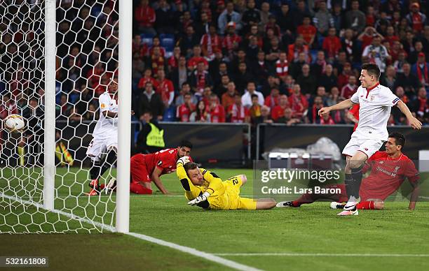 Kevin Gameiro of Sevilla scores his team's first goal past Simon Mignolet of Liverpool during the UEFA Europa League Final match between Liverpool...