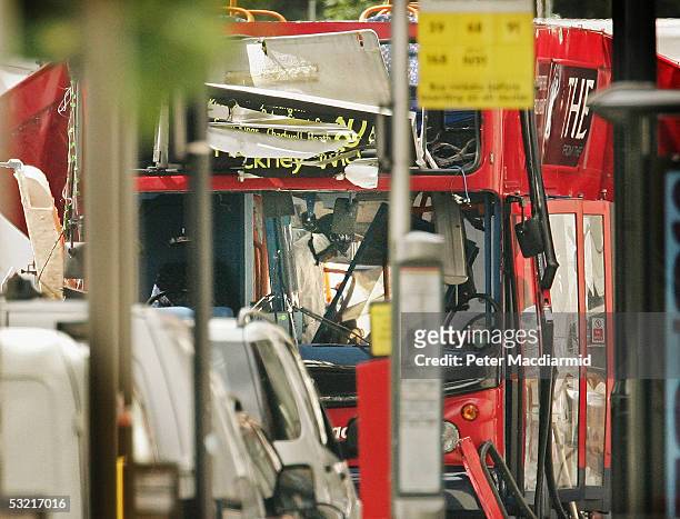 Police forensic officer is seen inside the bombed bus in Tavistock Square on July 9, 2005 London. At least 49 people were killed and 700 injured...