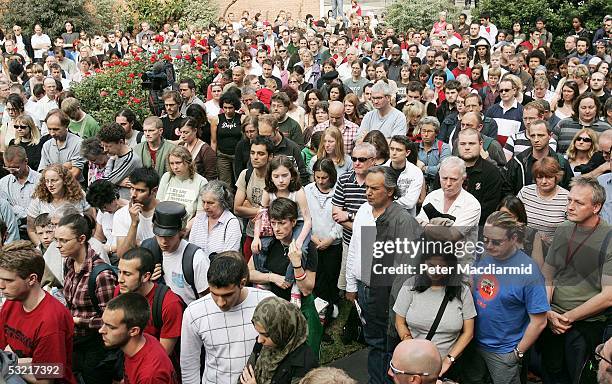 People observe a two minute silence in memory of the victims of the London bombings at a vigil on July 9, 2005 London. A massive police investigation...