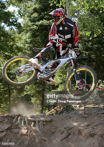Greg Minnaar of South Africa rides during the semi finals of the Downhill Event at the UCI Mountain Bike World Cup July 9, 2005 at the Angel Fire...