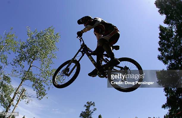 Luke Strom of Australia rides during the semi finals of the Men's Downhill Event at the UCI Mountain Bike World Cup at the Angel Fire Resort July 9,...