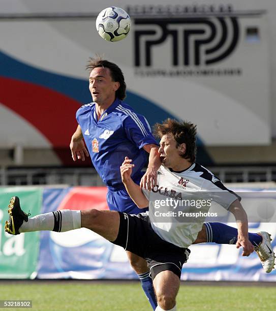 Dmitri Godunok of FC Moscow, Moscow challenges Sergey Rogachev of Saturn, Ramenskoe during the Russian Premier League match July 9, 2005 in Moscow,...