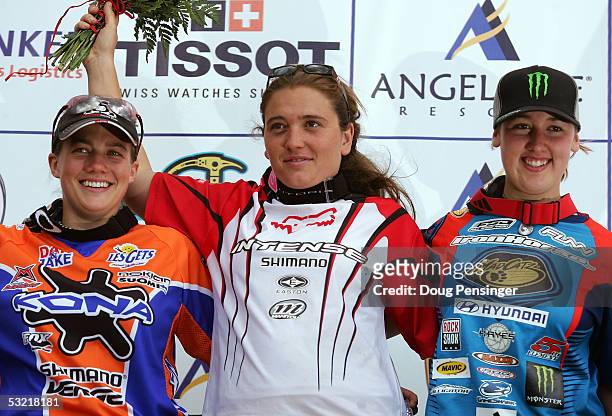 Third place finsiher, Tracy Moseley of Great Britain , race winner Sabrina Jonnier of France , and second place finisher Scarlet Hagen of New...