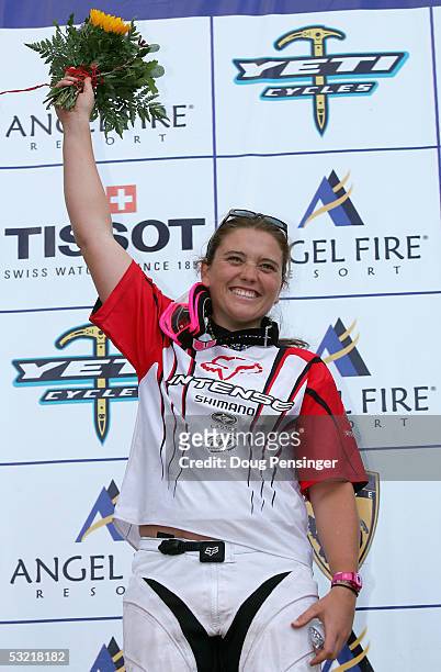 Sabrina Jonnier of France takes the podium after winning the Women's Downhill Event and retaining the series point lead at the UCI Mountain Bike...