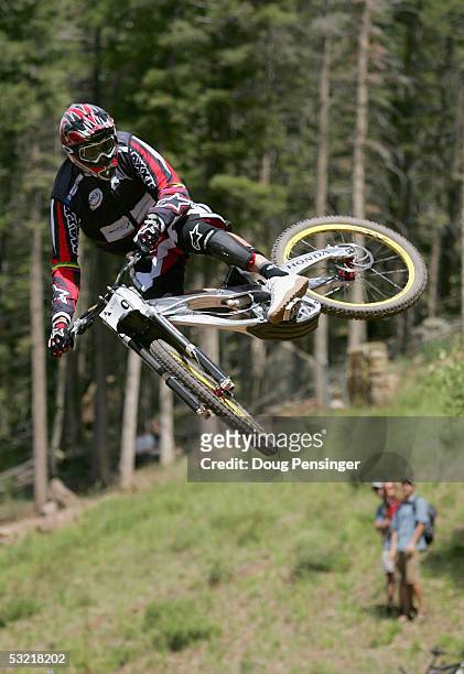 Greg Minnaar of South Africa goes airborne during the finals of the Downhill Event as he finsihed first at the UCI Mountain Bike World Cup at the...