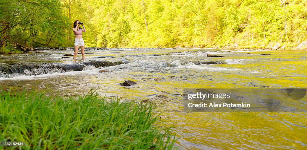 Teenager girl exploring wildlife. Oosterneck Creek, Great Smoky Mountains, Tennessee