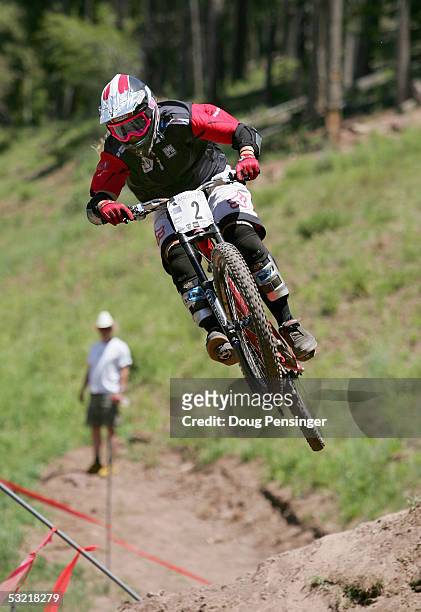 Sabrina Jonnier of France rides during the finals as she won the Women's Downhill Event and retained the series point lead at the UCI Mountain Bike...