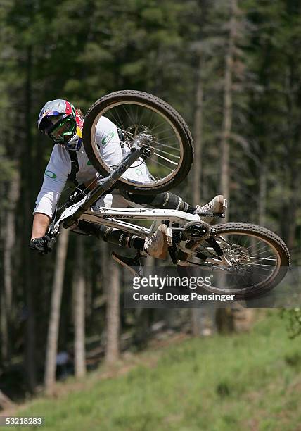 Kyle Strait of the USA goes airborne with style during the finals as he finished 21st in the Men's Downhill Event at the UCI Mountain Bike World Cup...