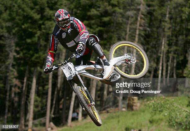 Greg Minnaar of South Africa goes airborne during the finals of the Downhill Event as he finsihed first at the UCI Mountain Bike World Cup at the...