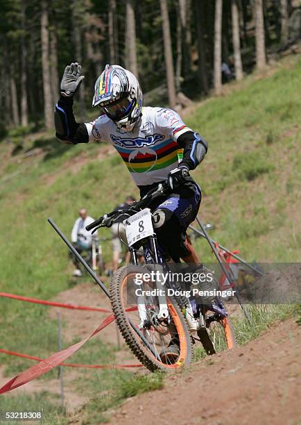 Reigning Downhill World Champion Fabien Barel of France acknowledges the crowd as he flatted during the finals of the Men's Downhill Event at the UCI...