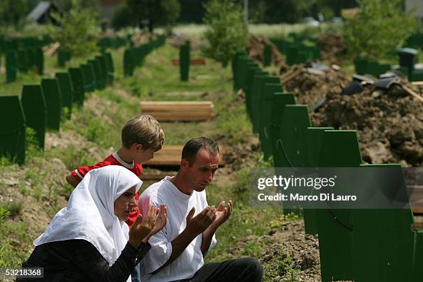 Family prays at the Srebrenica Memorial July 9, 2005 in Srebrenica, Bosnia Herzegovina. Preparations for the upcoming 10th anniversary of the...