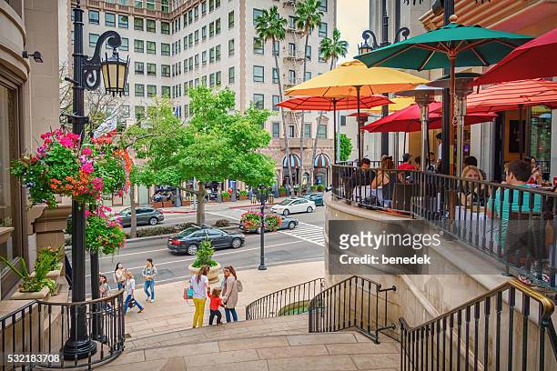restaurant patio with people in beverly hills los angeles california - beverly hills restaurant stock pictures, royalty-free photos & images
