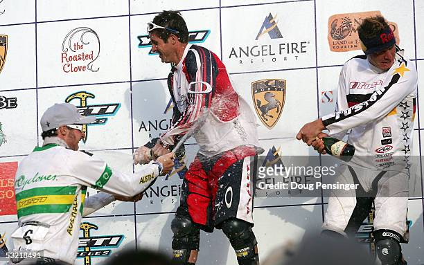 Winner Brian Lopes of the USA is dowsed with champagne by Guido Tschugg in second place from Germany and Jared Graves in third place from Australia...