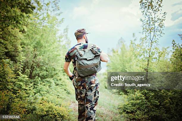 soldier alone in the mountains - military rucksack stock pictures, royalty-free photos & images