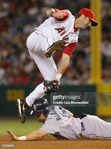 Willie Bloomquist of the Seattle Mariners steals second base against Adam Kennedy of the Los Angeles Angels of Anaheim in the 5th innning on July 9,...