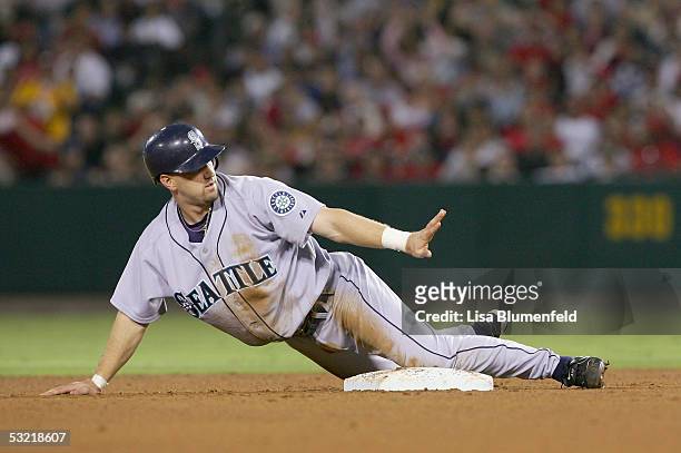 Willie Bloomquist of the Seattle Mariners steals second base against the Los Angeles Angels of Anaheim in the 5th innning on July 9, 2005 at Angel...