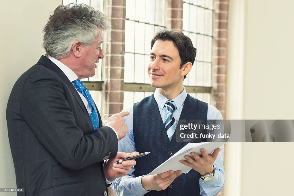 Experienced Management Experienced Manager With Young Employee High-Res Stock Photo - Getty Images