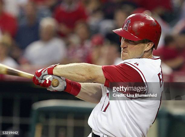 Darin Erstad of the Los Angeles Angels of Anaheim brings in a run against the Seattle Mariners on July 9, 2005 at Angel Stadium in Anaheim,...