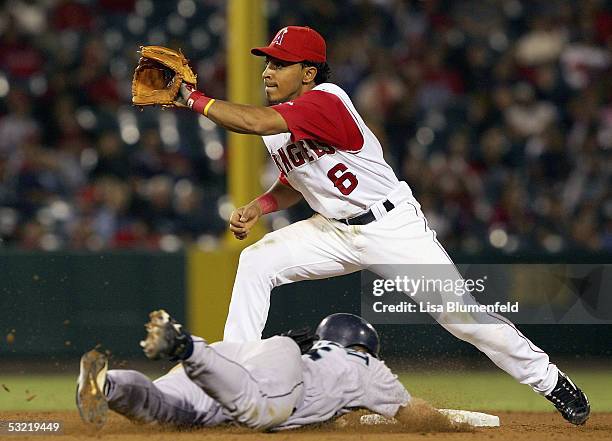 Willie Bloomquist of the Seattle Mariners is safe at second base in the 9th inning against Maicer Izturis of the Los Angeles Angels of Anaheim on...