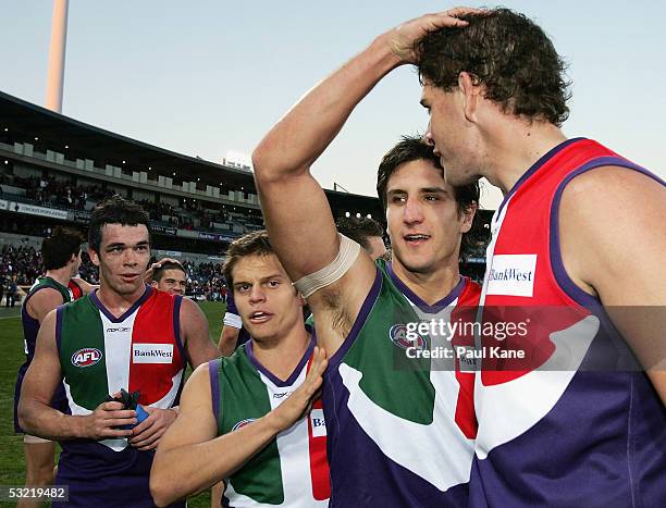 Matthew Pavlich of the Dockers celebrates with Aaron Sandilands and Byron Schammer after winning the round 15 AFL match between the Fremantle Dockers...