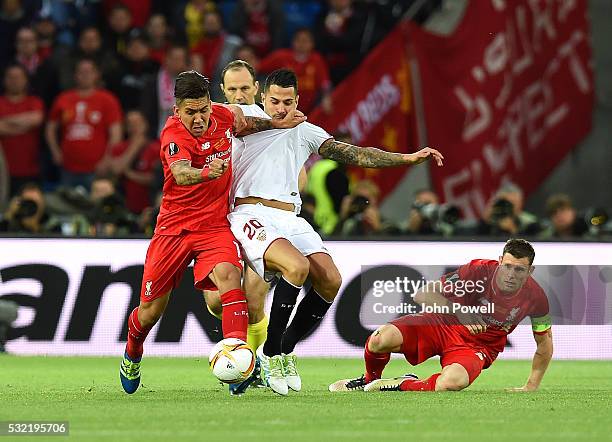 Roberto Firmino of Liverpool competes with Vitolo of Sevilla during the UEFA Europa League Final match between Liverpool and Sevilla at St....