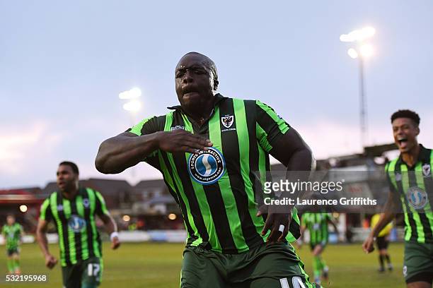 Adebayo Akinfenwa of AFC Wimbledon celebrates after scoring a goal to level the aggregate scores at 2-2 during the Sky Bet League Two play off,...