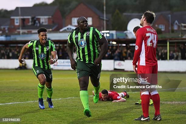 Adebayo Akinfenwa of AFC Wimbledon celebrates after scoring a goal to level the aggregate scores at 2-2 during the Sky Bet League Two play off,...