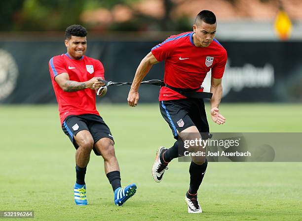 DeAndre Yedlin and Bobby Wood of the U.S. Men's National team run a drill during a training session on May 18, 2016 at Buccaneer Field on the campus...