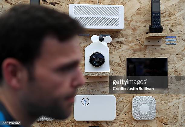 An attendee looks at a display of Nest products during Google I/O 2016 at Shoreline Amphitheatre on May 19, 2016 in Mountain View, California. Google...