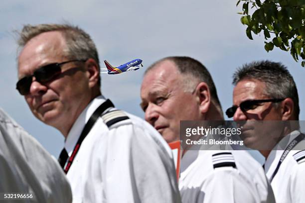 Southwest Airlines Co. Plane takes off as representatives and pilots from the Southwest Airlines Pilots' Association demonstrate outside Chicago...