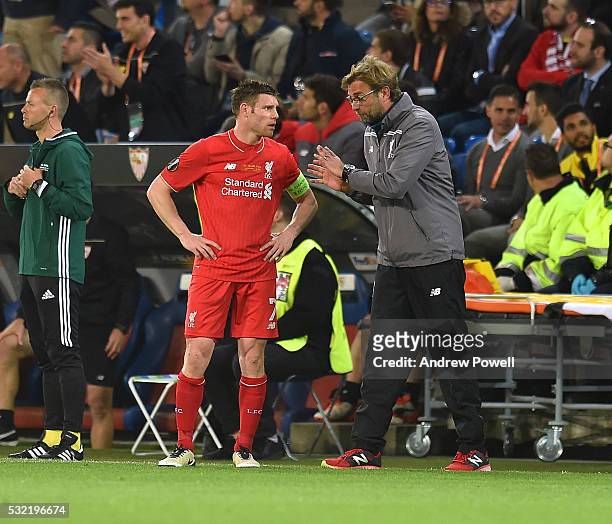 Jurgen Klopp manager of Liverpool talks with James Milner after conceding a goal during the UEFA Europa League Final match between Liverpool and...