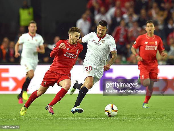 Adam Lallana of Liverpool competes with Vitolo of Sevilla during the UEFA Europa League Final match between Liverpool and Sevilla at St. Jakob-Park...