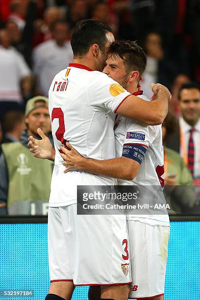 Coke of Sevilla celebrates scoring a goal to make the score 1-2 with Adil Rami during the UEFA Europa League Final between Liverpool and Sevilla at...