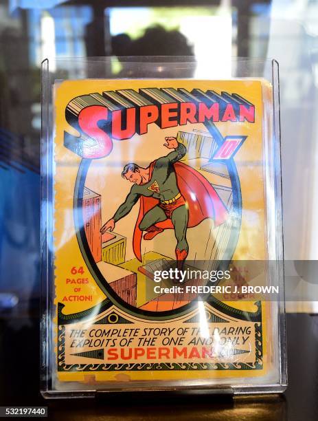 The very first Superman comic book from 1939 is displayed during Batman's cemetary visit is displayed during a press preview of "DC Universe: The...