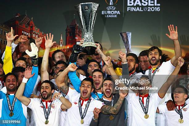 Captian Jose Antonio Reyes of Sevilla lifts the Europa League trophy as players celebrate at the award ceremoy after the UEFA Europa League Final...