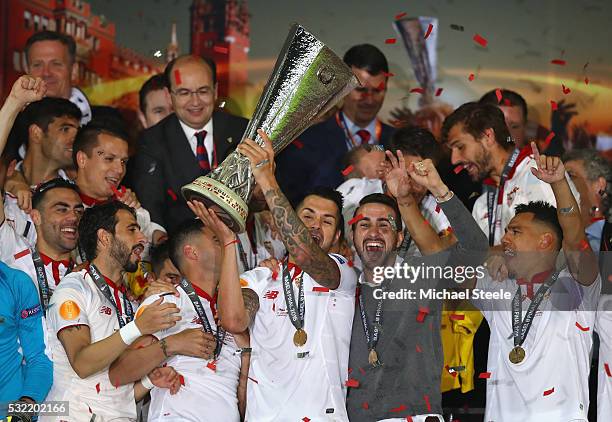 Vitolo of Sevilla lifts the Europa League trophy as players celebrate at the award ceremoy after the UEFA Europa League Final match between Liverpool...