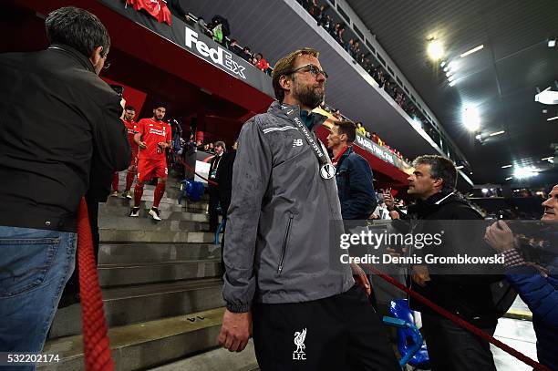 Jurgen Klopp, manager of Liverpool walks after receiving the runners-up medal at the award ceremony after the UEFA Europa League Final match between...