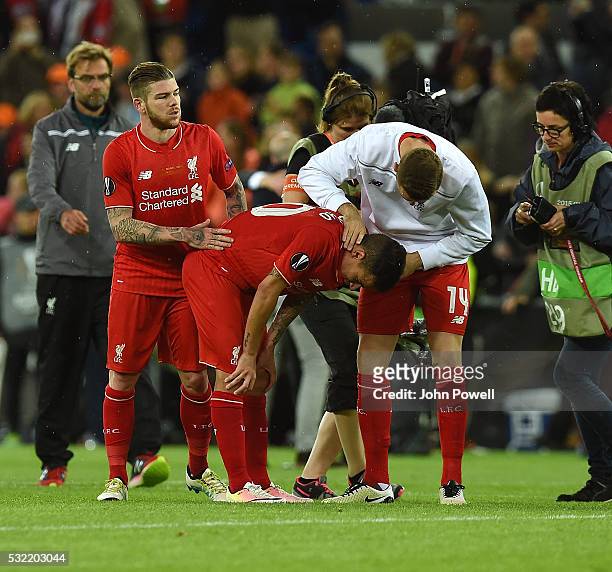 Jordan Henderson of Liverpool embraces Philippe Coutinho at the end of the UEFA Europa League Final match between Liverpool and Sevilla at St....