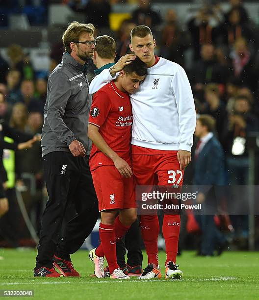 Jordan Henderson of Liverpool embraces Philippe Coutinho at the end of the UEFA Europa League Final match between Liverpool and Sevilla at St....