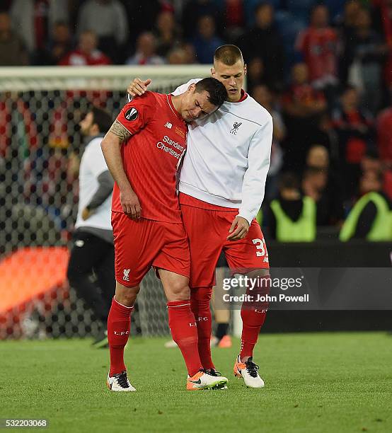 Martin Skrtel of Liverpool embraces Dejan Lovren at the end of the UEFA Europa League Final match between Liverpool and Sevilla at St. Jakob-Park on...