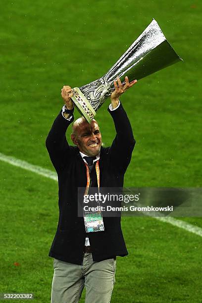 Ramon Rodriguez Verdejo, director of football of Sevilla lifts the trophy after the UEFA Europa League Final match between Liverpool and Sevilla at...