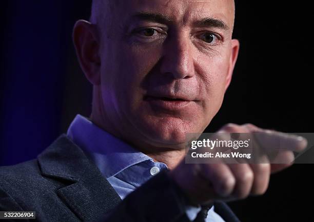 Jeff Bezos, founder and Chief Executive of Amazon.com and owner of The Washington Post, participates in a conversation during the event...