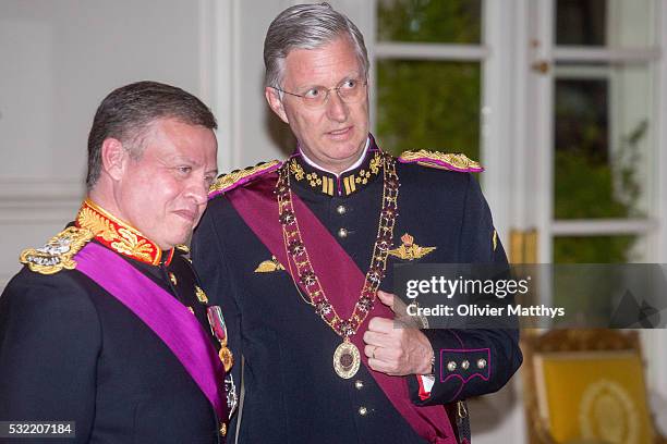 King Abdullah II of Jordan and King Philippe of Belgium talk prior to the gala dinner at the Royal Palace of Lakaen on May 18, 2016 in Brussels,...