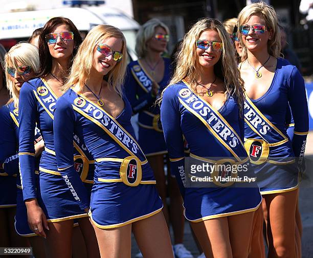 Grid girls smile on before the drivers parade of the British F1 Grand Prix on July 10, 2005 in Silverstone, England.