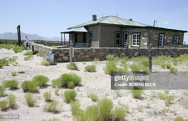 White Sands, UNITED STATES: TO GO WITH AFP STORY "WWII-HISTORY-JAPAN-US-NUCLEAR-BOMBS-TEST" BY MARC LAVINE A visitor leaves the McDonald Ranch House...